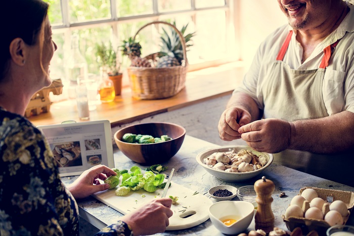 Closeup,of,people,preparing,vegetable,to,be,cooked,in,the