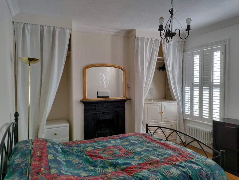 left wall with fire place and wardrobes 768x577