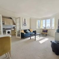 Bright room with door to kitchen