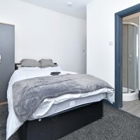 studio room in light greys and white