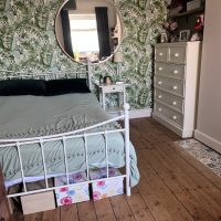 Iron bedstead in house share room