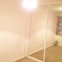 Picture of mirro fronted wardrobe in bedroom for rent