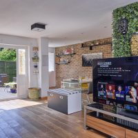 Large open plan room with TV