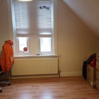 Under eaves room with desk in croydon