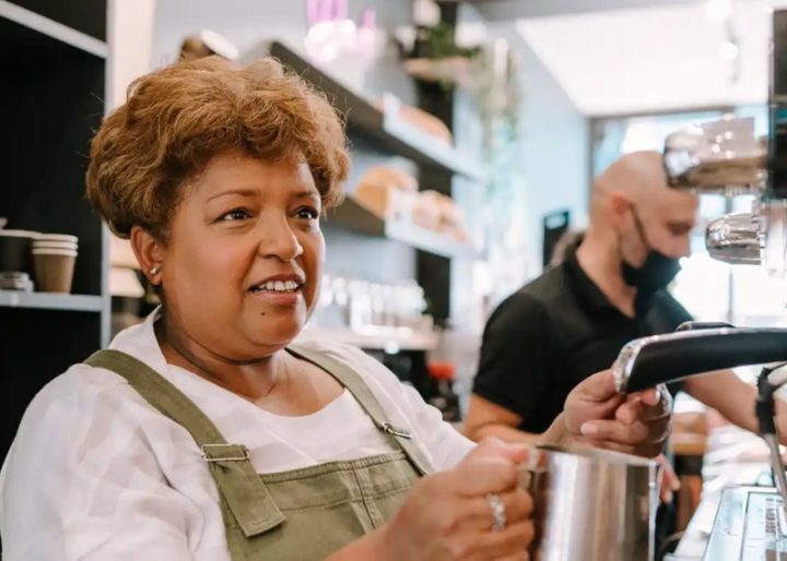 Older woman working as a Barista in London